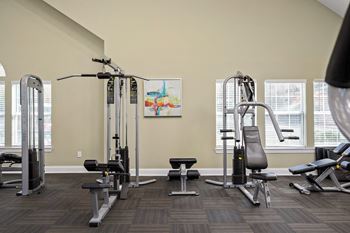 a gym with weights and cardio equipment at the at the park apartments  at 150 Summit, Birmingham, AL, 35243